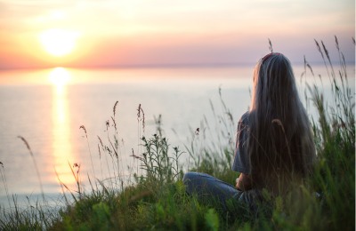 In memory In memory - image of person sitting alone looking out to sea