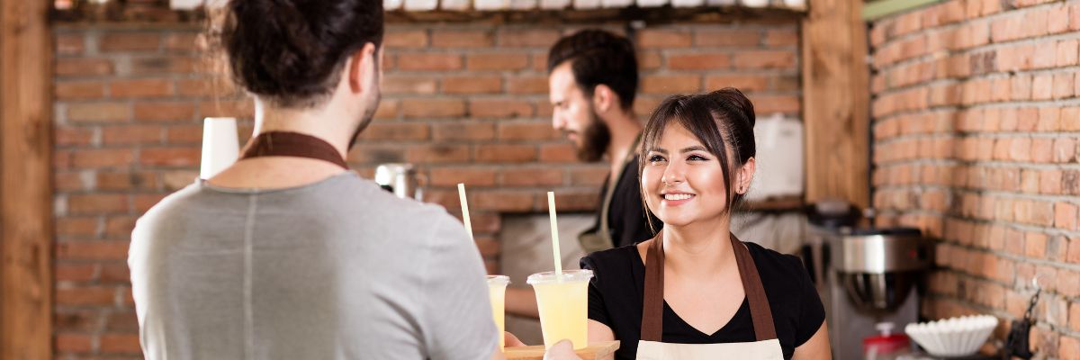 Team of baristas working in a cafe restaurant