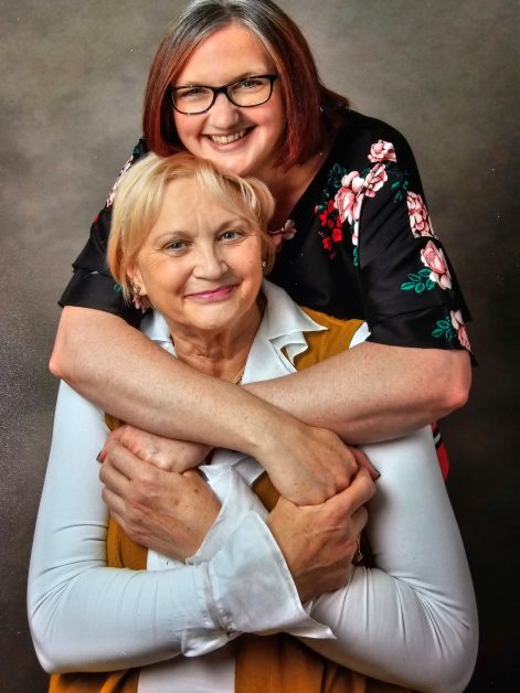 Photo of Sally and Judith hugging and smiling for the camera