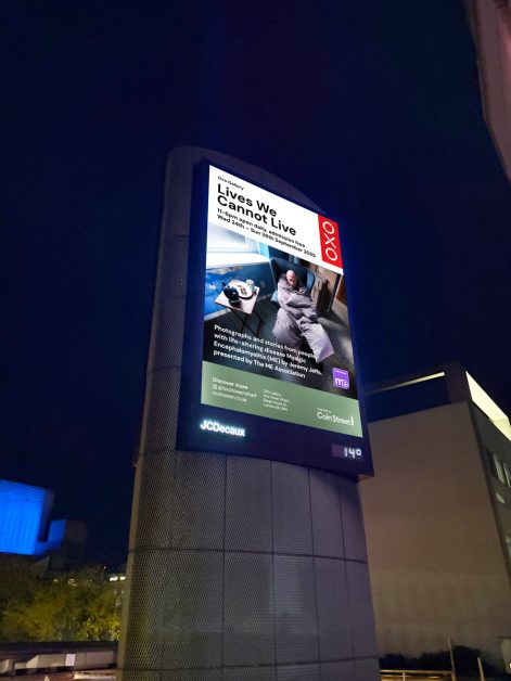 Lives We Cannot Live digital billboard on Waterloo Bridge by night