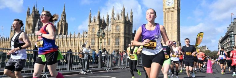 The London Landmarks Half Marathon - image shows runner Ciara raising money for the ME Association, and you can see Houses of Parliament in the background