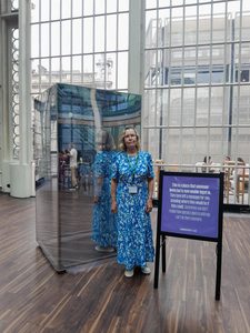 Photo of MEA Associate Trustee, Nicki Strong, stook next to the Mirrorbox