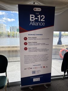 IMAGE DESCRIPTION: Photo of the B-12 Alliance Banner at the event